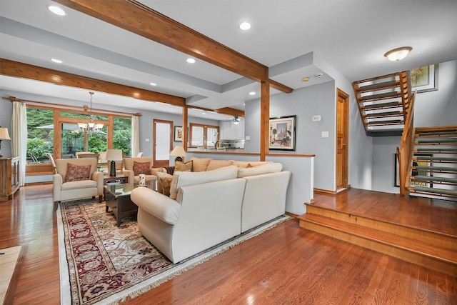 living area with stairway, wood finished floors, beam ceiling, recessed lighting, and baseboards