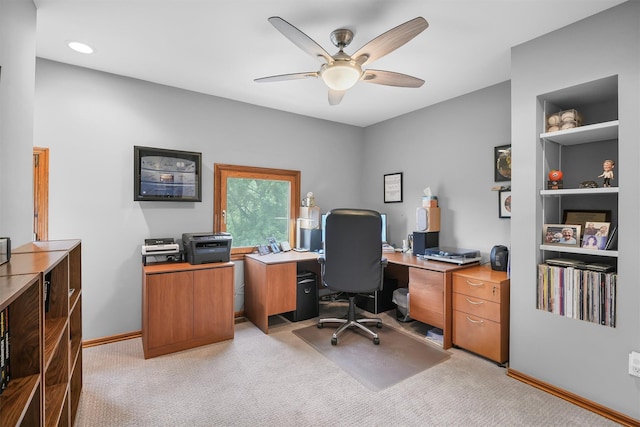 office area with ceiling fan, light carpet, baseboards, built in features, and recessed lighting