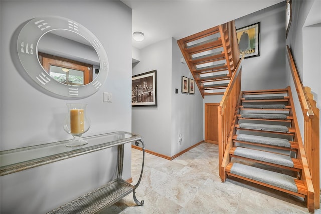 stairs featuring baseboards