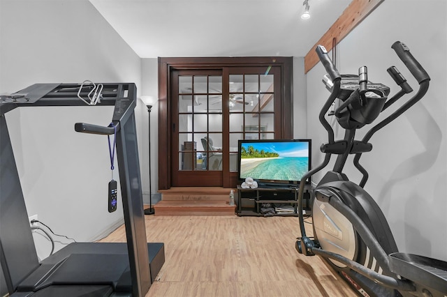 workout room featuring wood finished floors