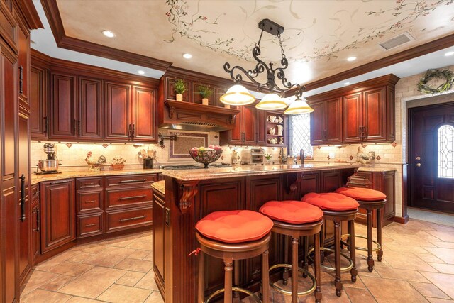4 Point Cres, Malba, NY 11357 - kitchen with reddish brown cabinets, stone tile floors, light stone counters, ornamental molding, and recessed lighting