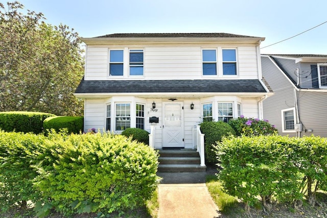 50 Fordham St, Williston Park, NY 11596 - view of front of house with roof with shingles