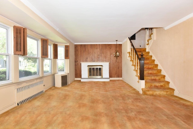 50 Fordham St, Williston Park, NY 11596 - unfurnished living room with radiator, healthy amount of natural light, stairs, crown molding, and carpet flooring