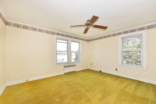 50 Fordham St, Williston Park, NY 11596 - unfurnished room with radiator, baseboards, light carpet, a ceiling fan, and ornamental molding