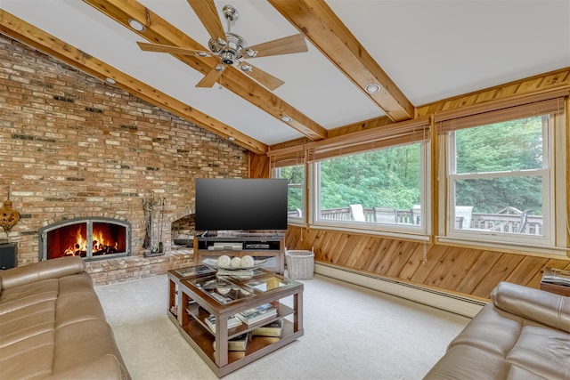 11 Kings Gate Rd, Suffern, NY 10901 - carpeted living area with a baseboard heating unit, ceiling fan, a fireplace, and wood walls