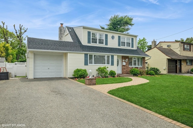 150 Arthur St, Massapequa Park, NY 11762 - traditional-style house with a garage, driveway, roof with shingles, a chimney, and brick siding