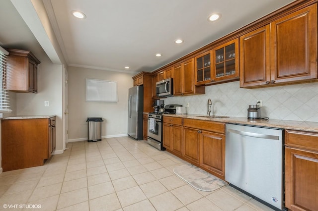 150 Arthur St, Massapequa Park, NY 11762 - kitchen featuring stainless steel appliances, a sink, recessed lighting, tasteful backsplash, and light stone counters