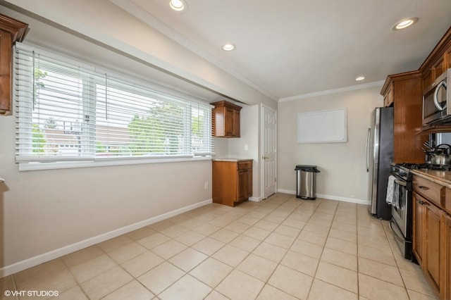 150 Arthur St, Massapequa Park, NY 11762 - kitchen with stainless steel appliances, ornamental molding, light countertops, baseboards, and recessed lighting