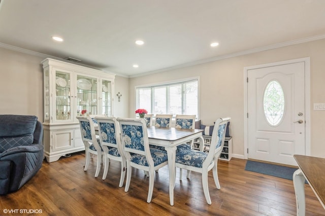 150 Arthur St, Massapequa Park, NY 11762 - dining area featuring dark wood finished floors, crown molding, and recessed lighting