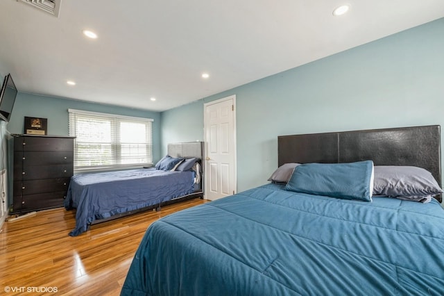 150 Arthur St, Massapequa Park, NY 11762 - bedroom with wood finished floors and recessed lighting