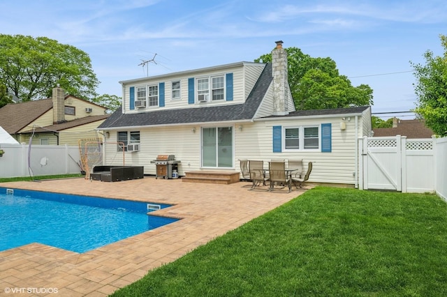 150 Arthur St, Massapequa Park, NY 11762 - back of house featuring a gate, a patio area, a chimney, and a shingled roof