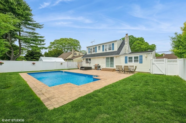 150 Arthur St, Massapequa Park, NY 11762 - rear view of house with a gate, a patio area, and a chimney