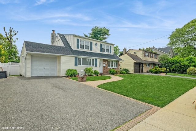 150 Arthur St, Massapequa Park, NY 11762 - traditional-style home featuring an attached garage, asphalt driveway, a chimney, and roof with shingles
