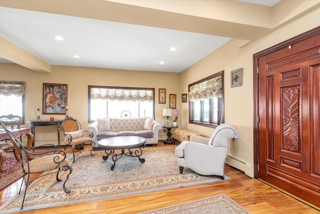 41-27 Orient Ave, Douglaston, NY 11363 - living room with a baseboard heating unit, wood finished floors, and recessed lighting