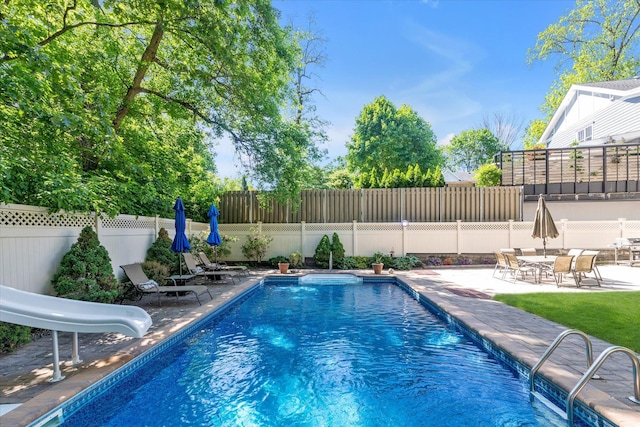 41-27 Orient Ave, Douglaston, NY 11363 - view of swimming pool with a water slide, a patio, and a fenced backyard