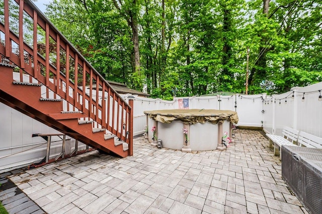 2588 Stedman Pl, Bronx, NY 10469 - fenced backyard featuring stairway, a patio area, and a gate