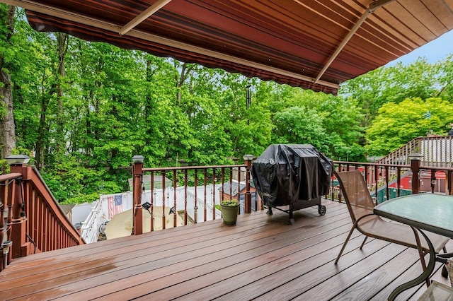 2588 Stedman Pl, Bronx, NY 10469 - wooden terrace with a grill and view of scattered trees