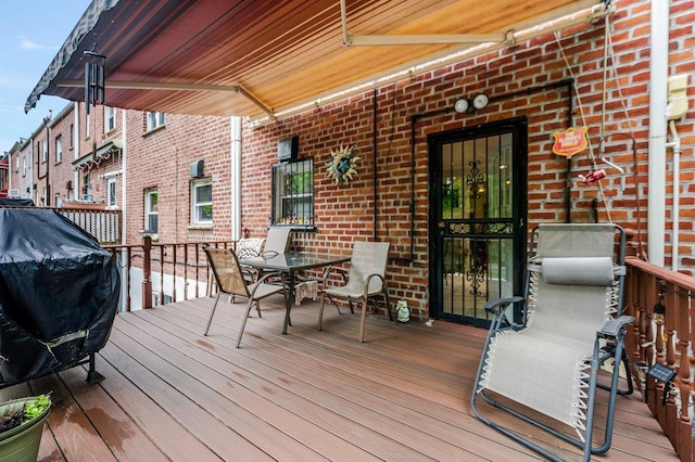 2588 Stedman Pl, Bronx, NY 10469 - deck with outdoor dining space and a grill