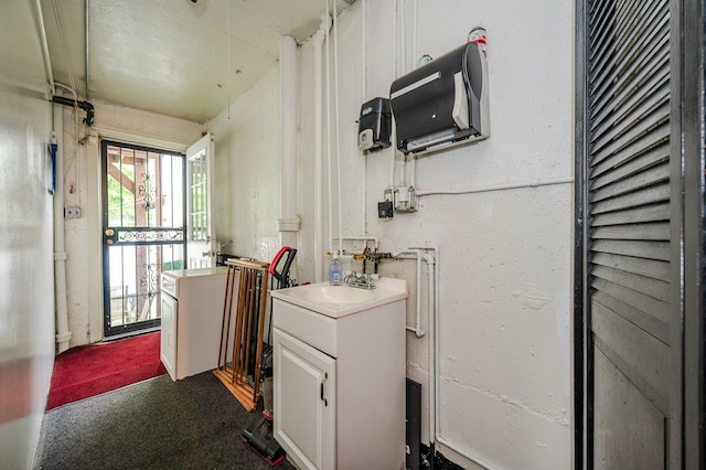 2588 Stedman Pl, Bronx, NY 10469 - kitchen with a sink, white cabinetry, light countertops, and dark carpet