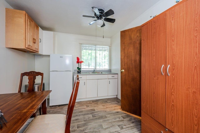 2588 Stedman Pl, Bronx, NY 10469 - kitchen featuring freestanding refrigerator, a sink, light wood finished floors, a ceiling fan, and lofted ceiling
