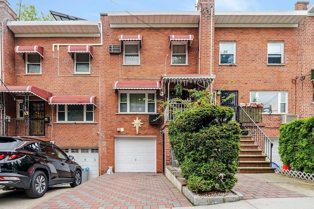 2588 Stedman Pl, Bronx, NY 10469 - view of property featuring an attached garage and driveway
