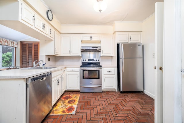 1427 Dartmouth St, Baldwin, NY 11510 - kitchen with appliances with stainless steel finishes, under cabinet range hood, a sink, light countertops, and brick flooring