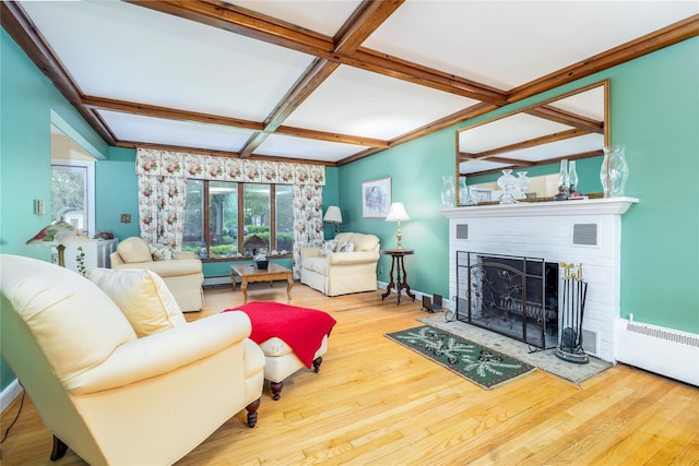 1427 Dartmouth St, Baldwin, NY 11510 - living area featuring coffered ceiling, a brick fireplace, radiator, wood finished floors, and beamed ceiling