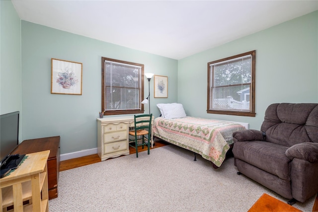 1427 Dartmouth St, Baldwin, NY 11510 - bedroom with baseboards and wood finished floors
