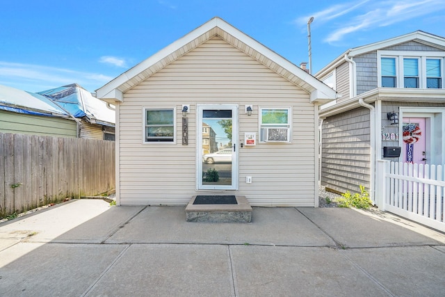 1203 Cross Bay Blvd, Broad Channel, NY 11693 - rear view of house featuring fence and a patio area