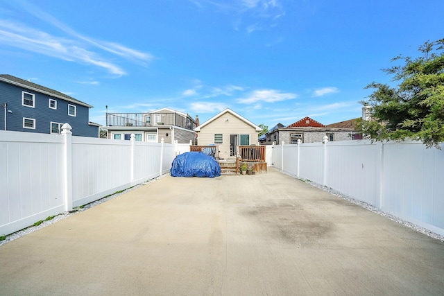 1203 Cross Bay Blvd, Broad Channel, NY 11693 - view of patio / terrace with a deck, a fenced backyard, and a residential view
