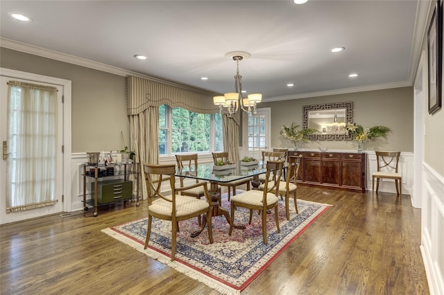 14 Rockwood Rd W, Manhasset, NY 11030 - dining room featuring ornamental molding, a chandelier, a decorative wall, wainscoting, and dark wood-style flooring