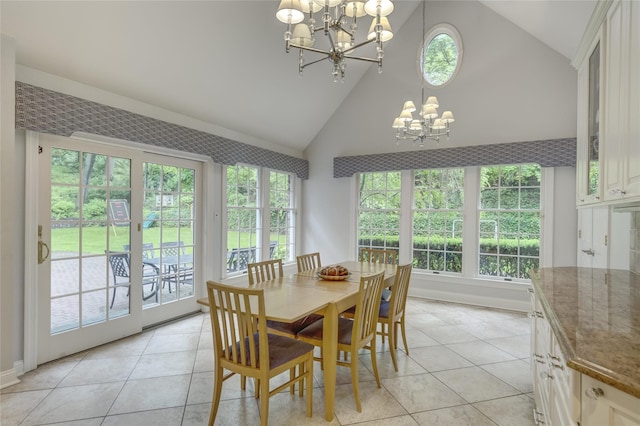 14 Rockwood Rd W, Manhasset, NY 11030 - dining space with a chandelier, healthy amount of natural light, light tile patterned floors, and high vaulted ceiling