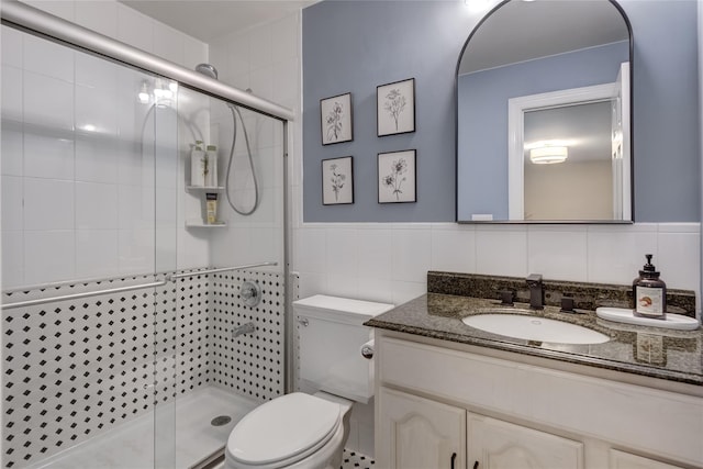 14 Rockwood Rd W, Manhasset, NY 11030 - full bathroom with vanity, toilet, tile walls, and a shower stall