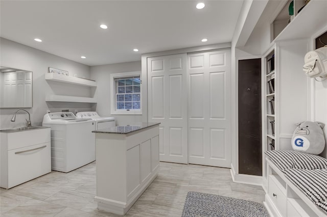 14 Rockwood Rd W, Manhasset, NY 11030 - laundry room with washer and clothes dryer, recessed lighting, light marble finish flooring, and cabinet space