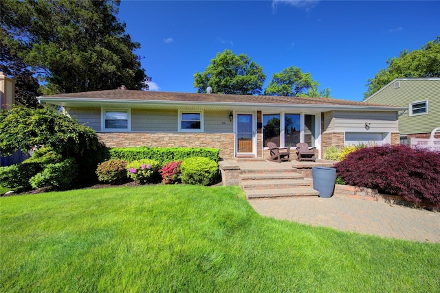 55 Richfield St, Plainview, NY 11803 - ranch-style home with a front yard, stone siding, and a garage
