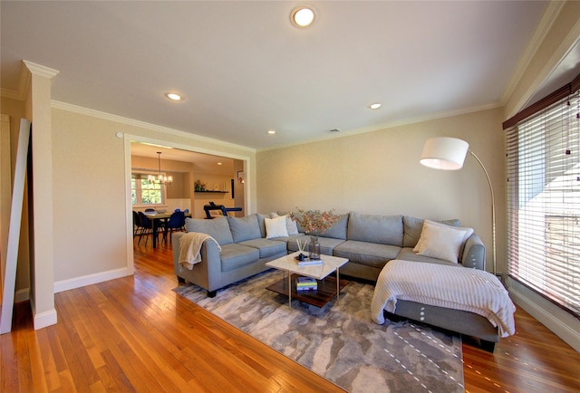 55 Richfield St, Plainview, NY 11803 - living area featuring a chandelier, wood finished floors, baseboards, crown molding, and recessed lighting