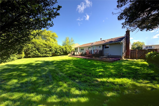 55 Richfield St, Plainview, NY 11803 - view of yard featuring a deck and a gate