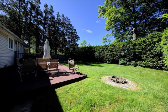 55 Richfield St, Plainview, NY 11803 - view of yard with a fire pit, outdoor dining space, and a deck