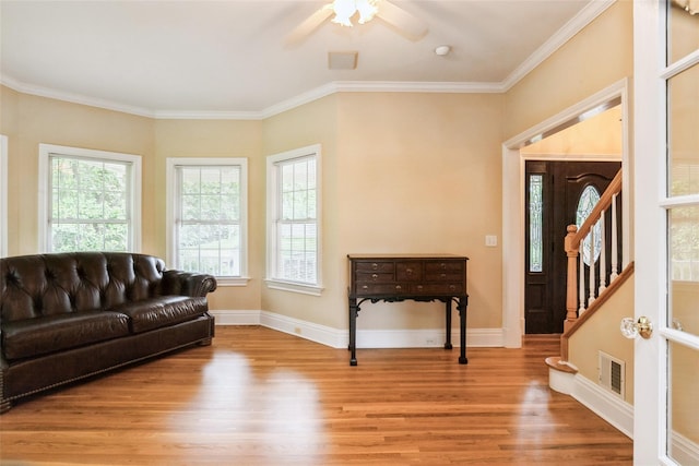 30 Lawrence Rd, Kings Park, NY 11754 - living room with wood finished floors, plenty of natural light, a ceiling fan, crown molding, and stairway