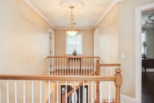 30 Lawrence Rd, Kings Park, NY 11754 - stairway featuring crown molding, baseboards, and wood finished floors