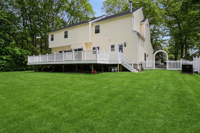 30 Lawrence Rd, Kings Park, NY 11754 - rear view of house with central air condition unit, a deck, and stairs