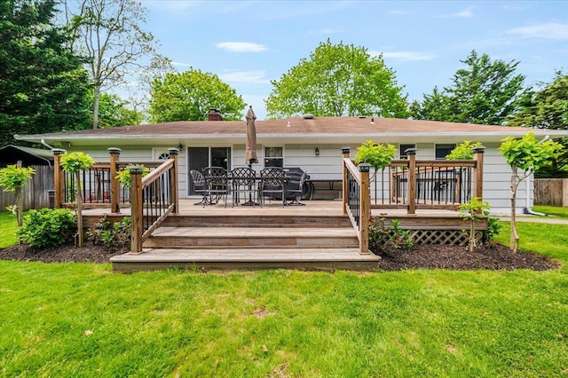 4200 Rocky Point Rd, East Marion, NY 11939 - rear view of house featuring a wooden deck and a chimney