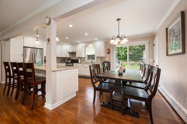 4200 Rocky Point Rd, East Marion, NY 11939 - dining area featuring a baseboard radiator, a chandelier, crown molding, dark wood finished floors, and baseboards