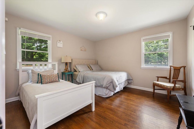 4200 Rocky Point Rd, East Marion, NY 11939 - bedroom featuring multiple windows and wood finished floors