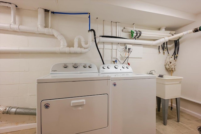 4200 Rocky Point Rd, East Marion, NY 11939 - laundry area featuring washer and clothes dryer and concrete block wall