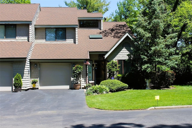 1 Rose Ct, East Islip, NY 11730 - view of front of home featuring driveway, a front lawn, a garage, and a shingled roof
