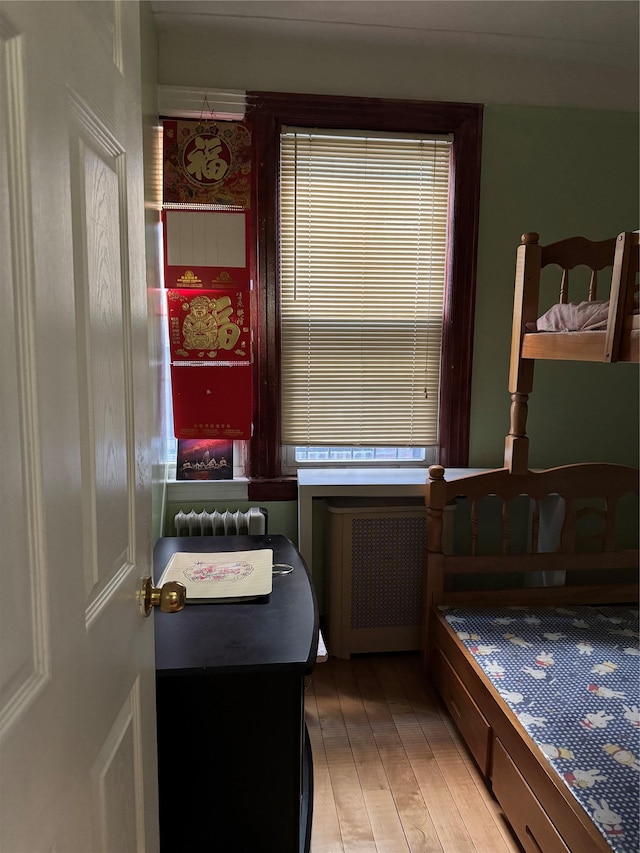 59-32 163rd St, Fresh Meadows, NY 11365 - bedroom with light wood finished floors and radiator heating unit