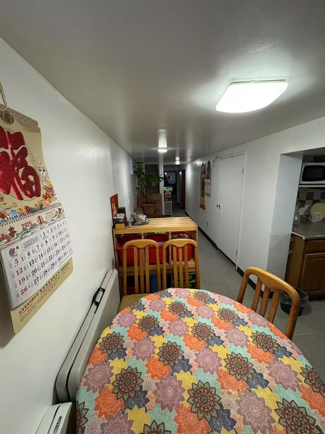 59-32 163rd St, Fresh Meadows, NY 11365 - dining space with a baseboard heating unit and bar
