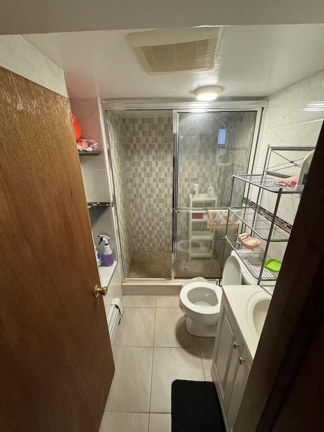 59-32 163rd St, Fresh Meadows, NY 11365 - full bath featuring a stall shower, tile patterned flooring, vanity, and toilet