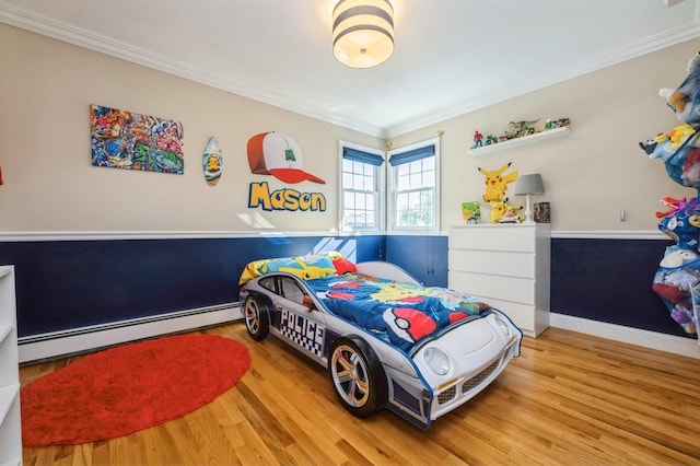 2033 Waltoffer Ave, North Bellmore, NY 11710 - bedroom featuring a baseboard radiator, wood finished floors, and crown molding